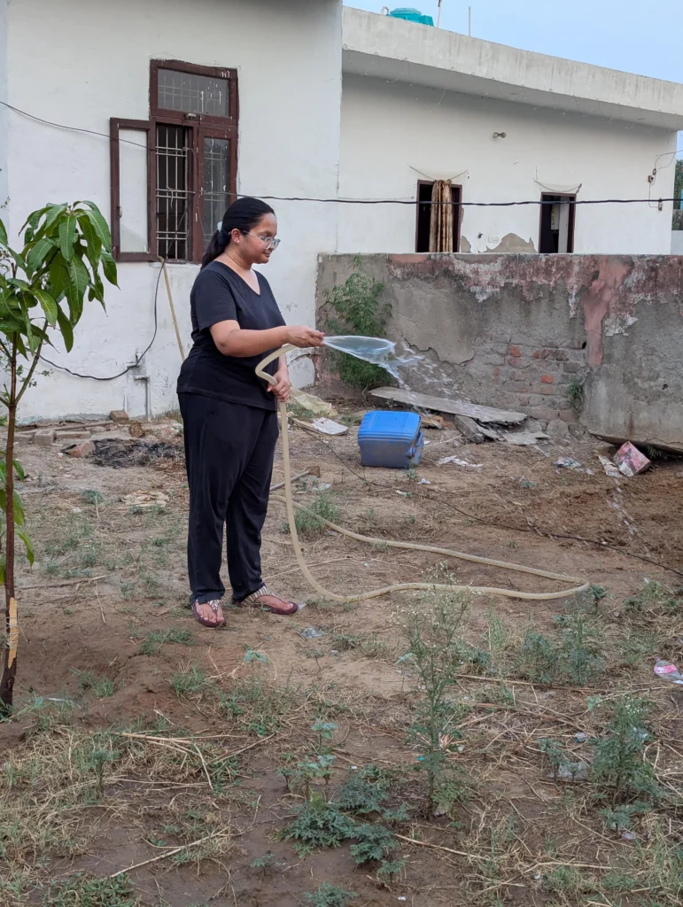 Preeti Gupta watering plants